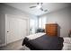 This bedroom offers plush carpet, a ceiling fan, and ample closet space at 5815 Pristine Falls Ave, Las Vegas, NV 89131