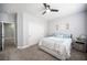 This bedroom has neutral walls, plush carpet, and a ceiling fan at 5815 Pristine Falls Ave, Las Vegas, NV 89131