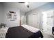 This bedroom boasts an ensuite bathroom, plush carpet, and a ceiling fan at 5815 Pristine Falls Ave, Las Vegas, NV 89131