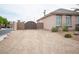 Gated gravel driveway leading to the property offering additional parking at 5815 Pristine Falls Ave, Las Vegas, NV 89131