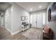 Inviting foyer with wood-look floors, stylish console table, and views to other rooms at 5815 Pristine Falls Ave, Las Vegas, NV 89131