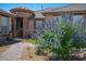 Charming front yard with a brick walkway, mature landscaping, and a well-maintained exterior at 5815 Pristine Falls Ave, Las Vegas, NV 89131