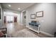 Spacious hallway with wood-look floors, views to a living room and stylish decor at 5815 Pristine Falls Ave, Las Vegas, NV 89131