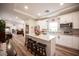 This kitchen offers ample counter space, bright lighting, and views into the living room at 5815 Pristine Falls Ave, Las Vegas, NV 89131
