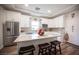 This kitchen has white cabinets, stainless appliances, and a large center island at 5815 Pristine Falls Ave, Las Vegas, NV 89131