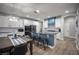 Modern kitchen with a large island, granite counters, stainless appliances, and dining table at 5815 Pristine Falls Ave, Las Vegas, NV 89131