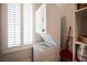 Laundry area with compact stackable washer and dryer at 5815 Pristine Falls Ave, Las Vegas, NV 89131