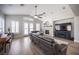 Living room showcases tile flooring, fireplace, plantation shutters, vaulted ceilings, and stylish decor at 5815 Pristine Falls Ave, Las Vegas, NV 89131