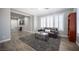 Stylish living room with wood floors, plantation shutters, and modern furniture at 5815 Pristine Falls Ave, Las Vegas, NV 89131