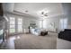 Serene main bedroom with tray ceiling, plush carpet, fireplace, ensuite bath and french doors at 5815 Pristine Falls Ave, Las Vegas, NV 89131