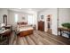 Large bedroom with laminate floors, ample space, and a walk in closet at 5815 Pristine Falls Ave, Las Vegas, NV 89131