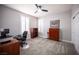 Cozy office featuring gray walls, plantation shutters, modern ceiling fan, and plush carpeting at 5815 Pristine Falls Ave, Las Vegas, NV 89131