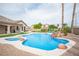 Private backyard pool and jacuzzi with nearby patio, perfect for outdoor relaxation and entertainment at 5815 Pristine Falls Ave, Las Vegas, NV 89131