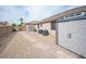 Side yard area with storage sheds and gravel at 5815 Pristine Falls Ave, Las Vegas, NV 89131