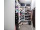 Organized walk-in closet with shelving, storage baskets, security safe, shoe racks, and hanging clothes at 5815 Pristine Falls Ave, Las Vegas, NV 89131