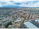 Wide aerial shot of the surrounding neighborhood with nearby commercial buildings at 5906 Bunch St, Las Vegas, NV 89122