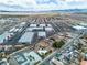 Wide aerial shot of the surrounding neighborhood and nearby industrial buildings at 5906 Bunch St, Las Vegas, NV 89122