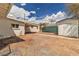 Backyard with a storage shed, chain link fence, and desert landscaping at 5906 Bunch St, Las Vegas, NV 89122
