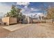 The backyard features storage containers, gravel, and a concrete slab, with plenty of usable space at 5906 Bunch St, Las Vegas, NV 89122