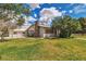 Spacious backyard featuring a lush lawn and mature trees; perfect for outdoor activities at 5906 Bunch St, Las Vegas, NV 89122
