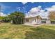 Well-maintained backyard featuring a lush lawn, mature trees, and ample space for outdoor activities at 5906 Bunch St, Las Vegas, NV 89122