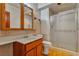 Bathroom features a vanity sink, tile accents, and a glass-enclosed shower for a clean aesthetic at 5906 Bunch St, Las Vegas, NV 89122