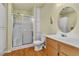 Bathroom featuring a walk-in shower, vanity, and storage at 5906 Bunch St, Las Vegas, NV 89122