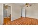 Bedroom with wood floors leading to an ensuite bathroom with walk-in shower at 5906 Bunch St, Las Vegas, NV 89122