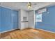 Cozy bedroom with laminate wood flooring, built-in storage, and natural light at 5906 Bunch St, Las Vegas, NV 89122