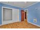 Cozy bedroom featuring built-in closet and drawers, plus laminate wood flooring at 5906 Bunch St, Las Vegas, NV 89122