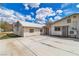 Back exterior of home, showing concrete patio, privacy fence, and mini-split AC at 5906 Bunch St, Las Vegas, NV 89122