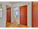 Hallway with hardwood flooring, and classic wooden doors, leading to bedrooms at 5906 Bunch St, Las Vegas, NV 89122