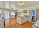 Charming kitchen featuring an island, hardwood floors, and ample natural light at 5906 Bunch St, Las Vegas, NV 89122