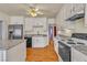 Kitchen with white cabinets, granite countertops, stainless appliances, and hardwood floors at 5906 Bunch St, Las Vegas, NV 89122
