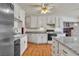 Bright kitchen features white cabinetry, granite countertops and stainless steel appliances at 5906 Bunch St, Las Vegas, NV 89122
