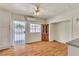 Spacious kitchen with wooden floors, backyard access and a decorative china cabinet at 5906 Bunch St, Las Vegas, NV 89122