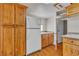 Efficient kitchenette with wood cabinets, sink, and essential appliances at 5906 Bunch St, Las Vegas, NV 89122