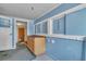 Bright laundry room with blue walls, natural light, storage and a water heater at 5906 Bunch St, Las Vegas, NV 89122