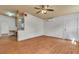 Spacious living room with wood floors, stylish fan, and bright natural light at 5906 Bunch St, Las Vegas, NV 89122