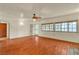 Spacious living room with wood flooring, white walls, and plenty of natural light at 5906 Bunch St, Las Vegas, NV 89122