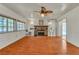 Comfortable living room with brick fireplace, built-in shelving, and ample natural light at 5906 Bunch St, Las Vegas, NV 89122
