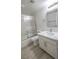 Bathroom with white vanity, marble countertop, and shower with sliding glass door at 601 Cabrillo Cir # 754, Henderson, NV 89015