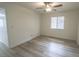 Well-lit bedroom with modern ceiling fan, hardwood floors, and window blinds at 601 Cabrillo Cir # 754, Henderson, NV 89015