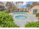 Beautiful community pool and spa area surrounded by lush greenery at 601 Cabrillo Cir # 754, Henderson, NV 89015
