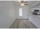Bright dining room with a ceiling fan, window, and wood look flooring at 601 Cabrillo Cir # 754, Henderson, NV 89015