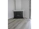 Cozy fireplace with white mantel and black screen, complementing the hardwood floors at 601 Cabrillo Cir # 754, Henderson, NV 89015