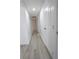 Hallway with hardwood floors and a view into other rooms of the home at 601 Cabrillo Cir # 754, Henderson, NV 89015