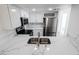 Bright kitchen featuring stainless steel appliances, marble countertops, white cabinetry, and stainless steel sink at 601 Cabrillo Cir # 754, Henderson, NV 89015