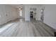 Bright living room featuring hardwood floors and an open floor plan into the kitchen at 601 Cabrillo Cir # 754, Henderson, NV 89015