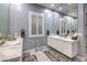 Elegant bathroom featuring double sinks, modern fixtures, and a well-lit vanity area for optimal functionality at 6103 Stone Rise St, Las Vegas, NV 89135